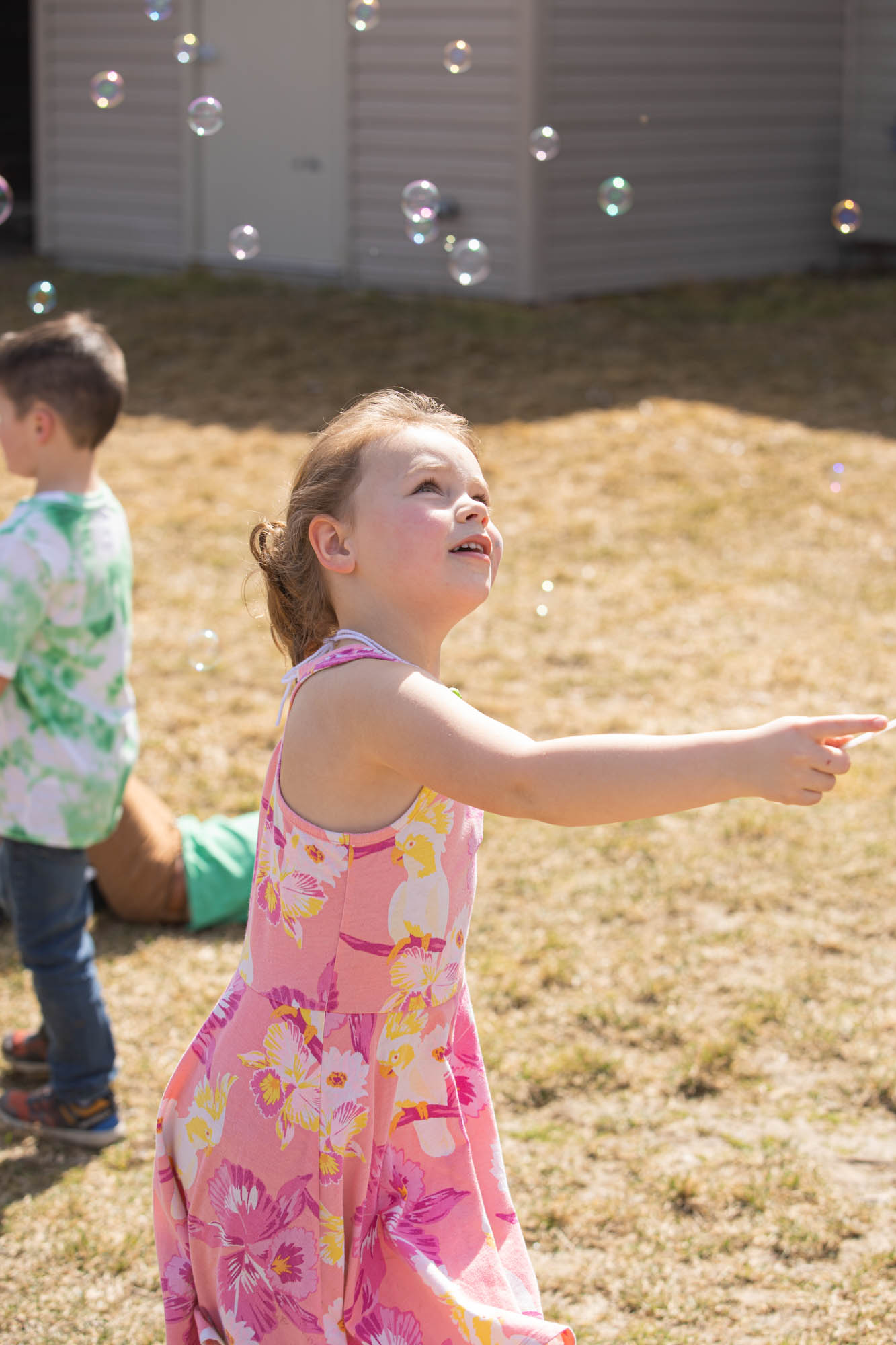 Girl playing with bubbles.
